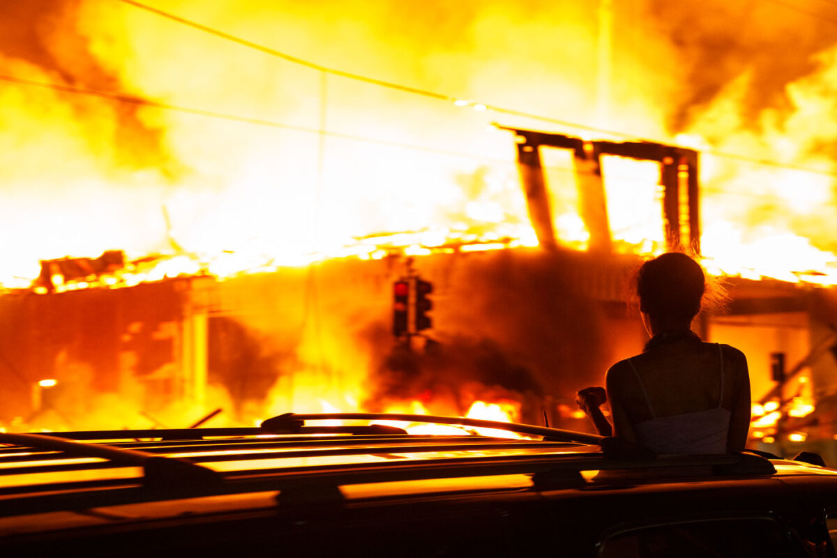 A 6-story new housing development on fire near the Minneapolis Police 3rd Precinct during the 2nd day of protests in Minneapolis following the death of George Floyd.