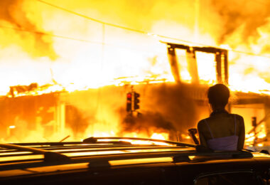A 6-story new housing development on fire near the Minneapolis Police 3rd Precinct during the 2nd day of protests in Minneapolis following the death of George Floyd.