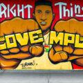 Mural located on Hennepin Avenue in Uptown Minneapolis by Adam Turman. The boards on Uptown Theatre read “Do the right thing” “Love MPLS” “Justice for George Floyd”.