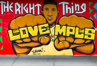 Mural located on Hennepin Avenue in Uptown Minneapolis by Adam Turman. The boards on Uptown Theatre read “Do the right thing” “Love MPLS” “Justice for George Floyd”.