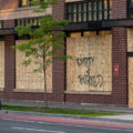 A cyclist bikes down Hennepin Avenue in Uptown Minneapolis past a boarded up Walgreens Pharmacy. 

Boards were placed after unrest in Minneapolis over the killing of George Floyd on May 25th, 2020.