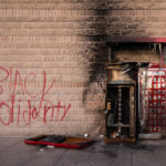 Burned out Red Box kiosk outside a Walgreens store. The store was burned weeks earlier during unrest in Minneapolis following the May 25th, 2020 death of George Floyd.