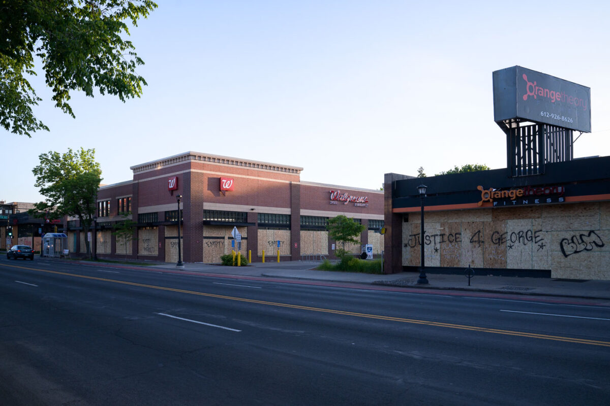 Boards covering Hennepin Avenue storefronts in Uptown Minneapolis after days of riots in Minneapolis following the death of George Floyd.