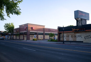 Boards covering Hennepin Avenue storefronts in Uptown Minneapolis after days of riots in Minneapolis following the death of George Floyd.