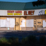 Boards on a strip mall in South Minneapolis during unrest in Minneapolis following the May 25th, 2020 death of George Floyd.Boards reading “Say His Name” “POC Owned” “BIPOC Owned”