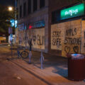 Boards reading "Stay Safe" "MPLS Strong" "Look for the helpers" "BLM" on the Iron Door Pub on Lyndale Ave in Uptown Minneapolis during protests following the murder of George Floyd. May 2020.