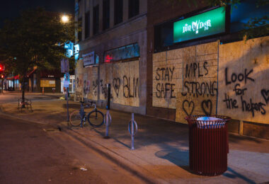 Boards reading "Stay Safe" "MPLS Strong" "Look for the helpers" "BLM" on the Iron Door Pub on Lyndale Ave in Uptown Minneapolis during protests following the murder of George Floyd. May 2020.