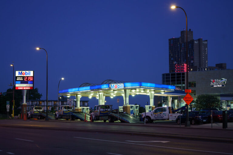 Tow trucks surround Bobby & Steves 1 Bobby & Steves convenience store an hour before a 10pm curfew goes into effect after days of unrest following the May 25th, 2020 death of George Floyd.
