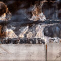 The remaining letters burned on the front of the Minneapolis Third Precinct. The precinct was burned during unrest over the killing of George Floyd.