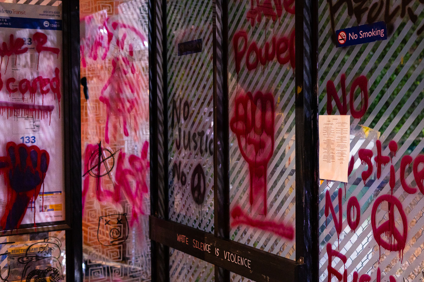 Bus shelter with graffiti on Chicago Ave