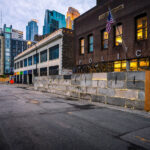 Minneapolis police 1st precinct concrete blocks 3 Concrete blocks and razor wire placed around the Minneapolis police 1st precinct police station in Downtown Minneapolis. The precinct was secured after the 3rd precinct police station was burned about 10 days prior after the death of George Floyd.