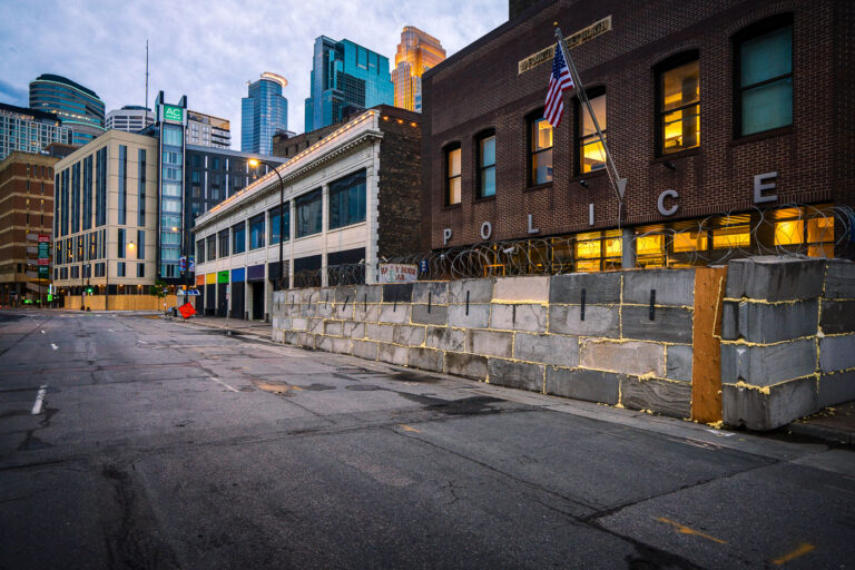 Minneapolis police 1st precinct concrete blocks 1 Concrete blocks and razor wire placed around the Minneapolis police 1st precinct police station in Downtown Minneapolis. The precinct was secured after the 3rd precinct police station was burned about 10 days prior after the death of George Floyd.