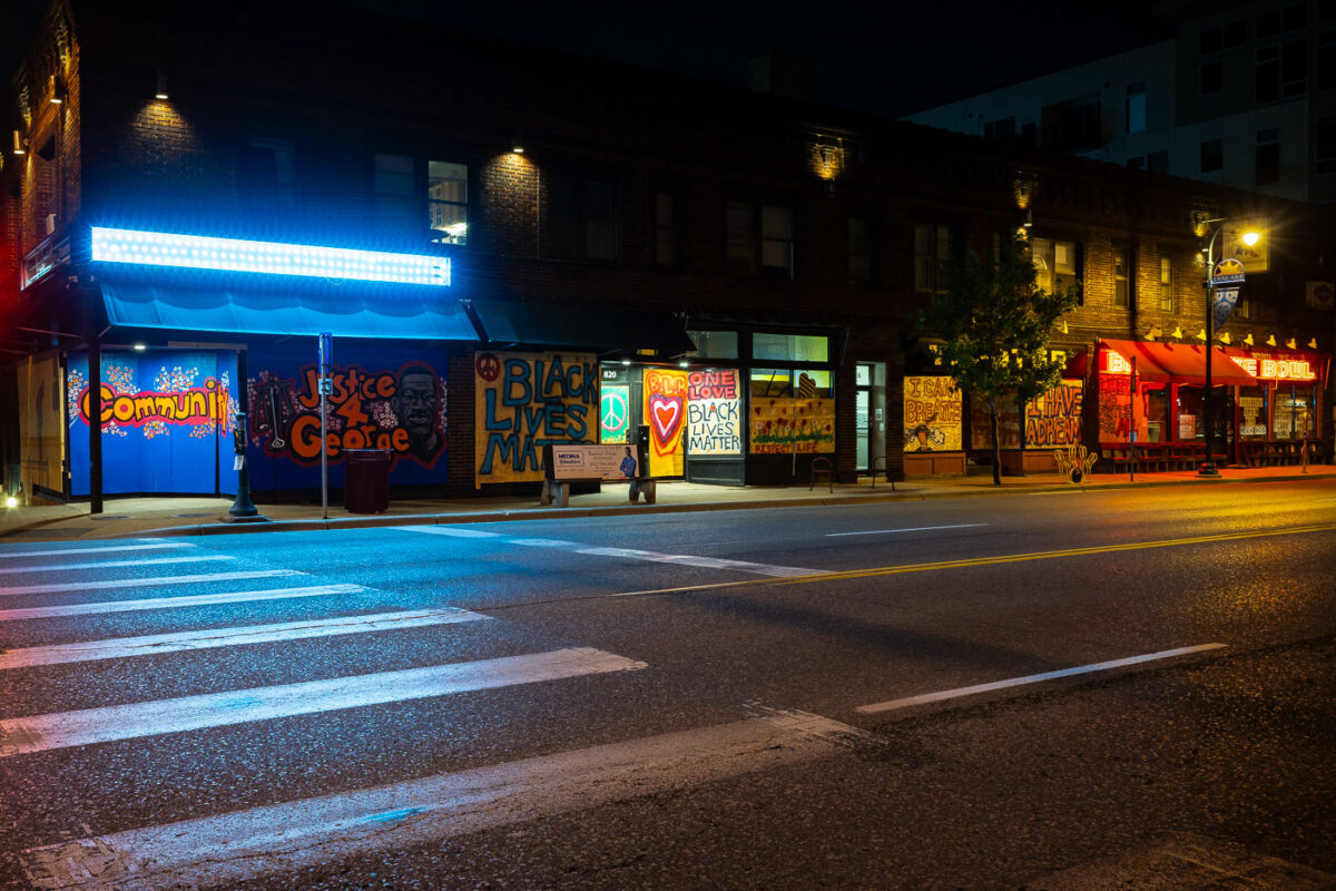 Painted boards on retail stores on West Lake Street.