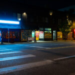Painted boards on retail stores on West Lake Street.