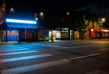 Painted boards on retail stores on West Lake Street.