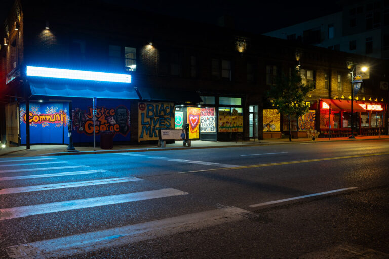 Graffiti on Lake Street boards 4 Painted boards on retail stores on West Lake Street.