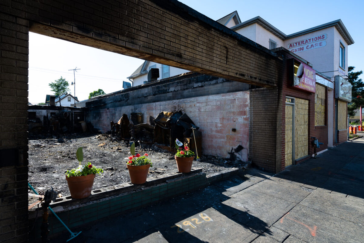 Flowers in the windows of a burned out restaurant on Chicago Ave.