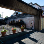 Flowers in the windows of a burned out restaurant on Chicago Ave.