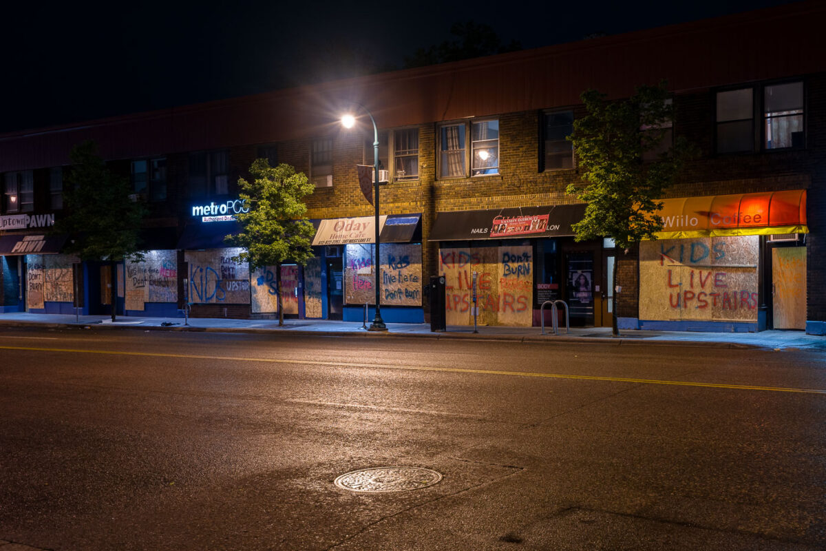 Decorated boards on buildings on Lake Street in Minneapolis. The boards went up during unrest in Minneapolis following the May 25th, 2020 death of George Floyd.