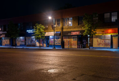 Decorated boards on buildings on Lake Street in Minneapolis. The boards went up during unrest in Minneapolis following the May 25th, 2020 death of George Floyd.