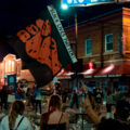 Protester holds up a “Black Lives Matter” flag at 38th St and Chicago Ave where George Floyd died on May 28th, 2020.