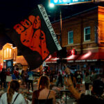 Protester holds up a “Black Lives Matter” flag at 38th St and Chicago Ave where George Floyd died on May 28th, 2020.