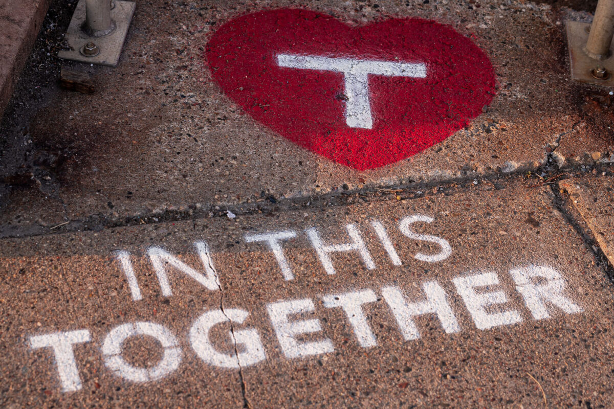 Stencil art placed by the Metro Transit outside their building in the North Loop. 

“In this together”