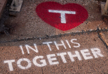 Stencil art placed by the Metro Transit outside their building in the North Loop. 

“In this together”