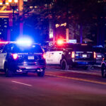 Minneapolis Police caravan drives down 1st Avenue to clear our "hot rodders". Hot rudders were gathering in the area doing “donuts” in intersections.