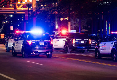 Minneapolis Police caravan drives down 1st Avenue to clear our "hot rodders". Hot rudders were gathering in the area doing “donuts” in intersections.