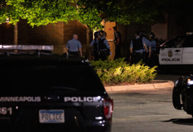 The Minneapolis Police enter the Sheraton Hotel in Midtown Minneapolis following calls regarding a fire inside.