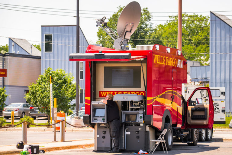 Wells Fargo Mobile ATM being worked on 3 After the Wells Fargo bank was destroyed by fire the month prior, the bank installed mobile ATMs.