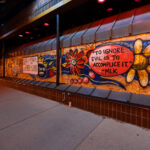 Painted boards at Red Cow Restaurant in Uptown Minneapolis. To ignore evil is to accomplice it  MLK