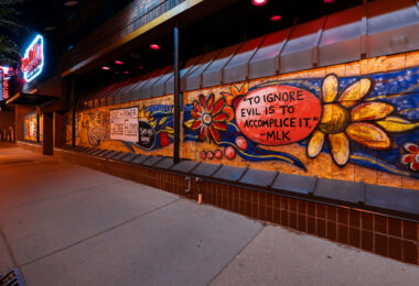 Painted boards at Red Cow Restaurant in Uptown Minneapolis. 

To ignore evil is to accomplice it  MLK