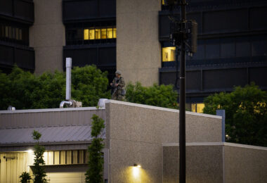 A National Guard member on the roof of the Hennepin County Sheriff’s Forensic Science Laboratory in downtown Minneapolis. About an hour later a 10pm curfew went into effect due to unrest over the death of George Floyd on May 25th while in the custody of the Minneapolis Police.