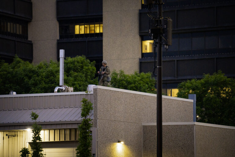 National Guard on top of Forensic Laboratory 4 A National Guard member on the roof of the Hennepin County Sheriff’s Forensic Science Laboratory in downtown Minneapolis. About an hour later a 10pm curfew went into effect due to unrest over the death of George Floyd on May 25th while in the custody of the Minneapolis Police.