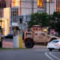 A National Guard vehicle drives through Downtown Minneapolis after days of unrest following the May 25th, 2020 death of George Floyd.