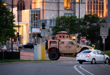A National Guard vehicle drives through Downtown Minneapolis after days of unrest following the May 25th, 2020 death of George Floyd.