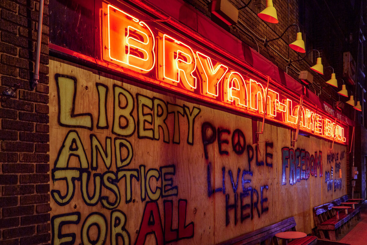 Bryant Lake Bowl boarded up after days of unrest in Minneapolis over the May 25th death of George Floyd. Boards reading “Liberty and Justice for all” “People live here” “Freedom”