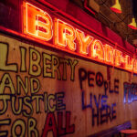 Bryant Lake Bowl boarded up after days of unrest in Minneapolis over the May 25th death of George Floyd. Boards reading “Liberty and Justice for all” “People live here” “Freedom”