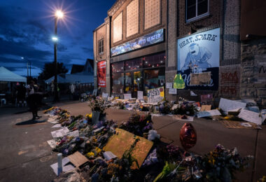Offerings left on Chicago Ave a week after George Floyd was killed.