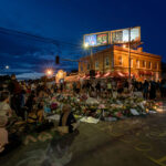 Community gathers on 06/04/20 at 38th St and Chicago Ave around a memorial for George Floyd who was killed on May 25th, 2020.