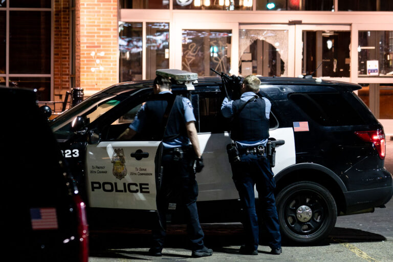 Police point guns at Sheraton Hotel 1 Officers point their guns at open windows at the Sheraton Hotel. The police had responded to reports of a fire inside as squatters took over.