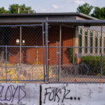 Razor wire and fencing surrounds the Minneapolis Police 5th precinct police station in South Minneapolis. The security was installed after days of protests following the May 25th death of George Floyd.