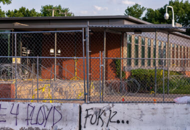 Razor wire and fencing surrounds the Minneapolis Police 5th precinct police station in South Minneapolis. The security was installed after days of protests following the May 25th death of George Floyd.