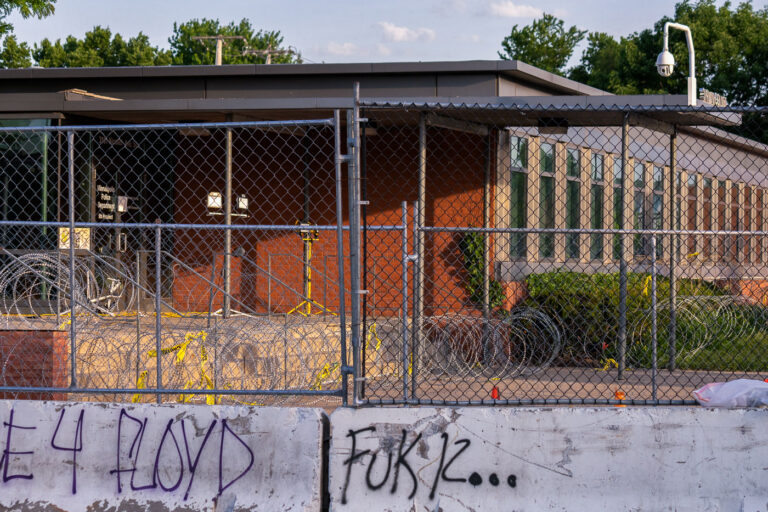 Minneapolis police station with razor wire 4 Razor wire and fencing surrounds the Minneapolis Police 5th precinct police station in South Minneapolis. The security was installed after days of protests following the May 25th death of George Floyd.