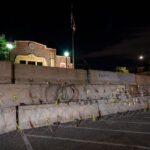 Minneapolis Police Department Second Precinct in Northeast Minneapolis behind razor wire and concrete barricades.