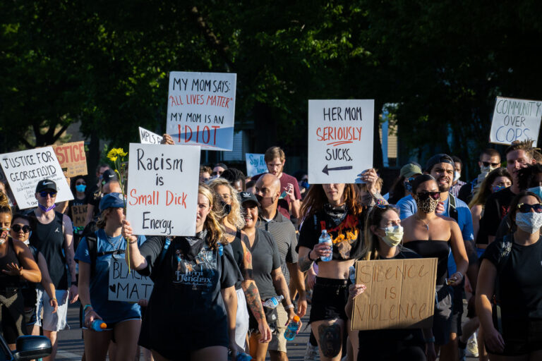 Racism is small dick energy 2 Protesters march down Park Ave into downtown Minneapolis.