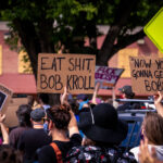 Protesters rally outside the Minneapolis Police Union Headquarters asking for Union President Bob Kroll to resign.