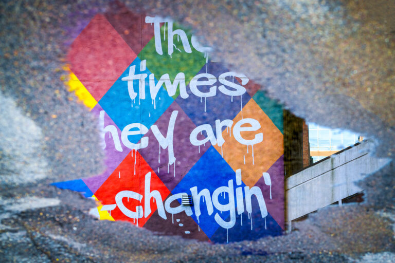 Bob Dylan mural in a puddle 4 A Bob Dylan mural on a building as seen from a puddle in Downtown Minneapolis.